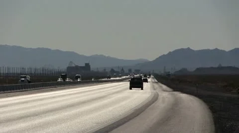 ROAD2LA-0022 TIMELAPSE TRAFFIC ON DESERT HIGHWAY Stock Footage 10713138