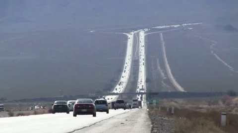 ROAD2LA-0026 LONG VISTA OF TRAFFIC ON DESERT HIGHWAY Stock Footage 10713176