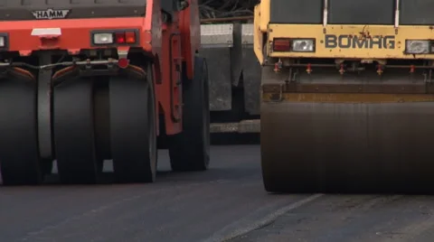Roading machinery - rollers compress asphalt Stock Footage 46868568