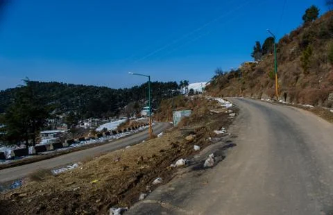 Roads covered by snow between mountains of Patnitop and nathatop Jammu Stock Photos