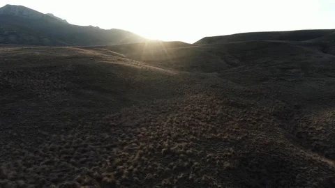 Roads at the foot of the mountain range Stock Footage 105679574