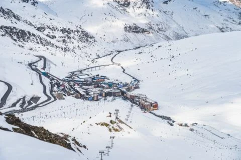 Roads going and out Pas de la Casa town in the valley between snow capped mou Stock Photos