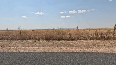 Roadside with barren landscape Stock Footage 283865895