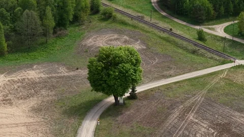 Roadside Chapel Under Lone Tree – Telephoto Orbit Right Aerial Establishing Stock-Footage 335098659