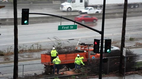 Roadside city crew doing work on rainy day timelapse clip 스톡 동영상 45295729