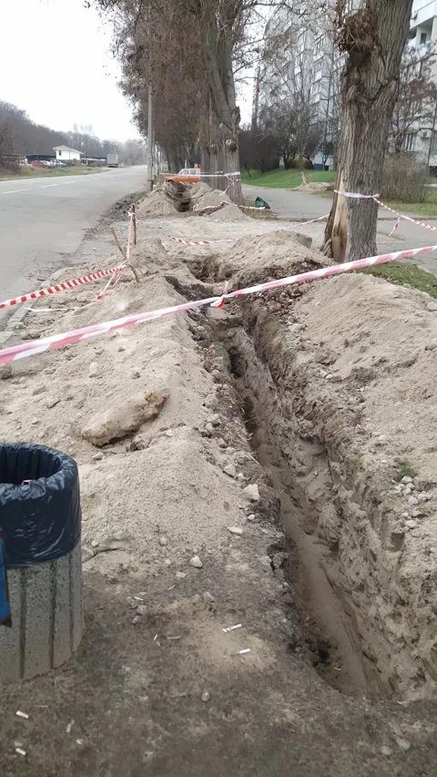 Roadside Construction Trench Cordoned Off with Warning Tape Stock Footage 326202737