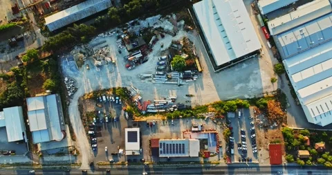 Roadside Diner Next To Construction Yard Early Morning Sun Rays Vibrant Aerial Stock-Footage 300446989