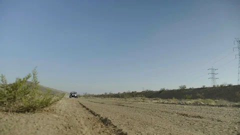 ROADSIDE DRIVE BY OF DUNE BUGGY DRIVING PAST CAMERA IN SLOW MOTION Stock Footage 127473902
