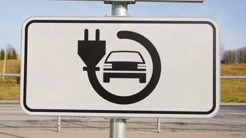 Roadside EV Charging Sign with Plug and ... | Stock Video | Pond5