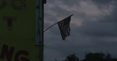 Roadside Flag Blowing in the Wind 4K Vídeos de archivo 84001446