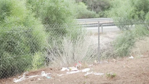 Roadside with garbage on the road in Spain Stock Footage 249664822