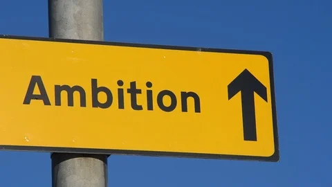 Roadside roadsign arrow pointing to ambition project uk Stock Footage 102156437