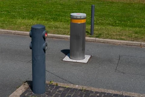 Roadside security bollards with red lights Stock Photos