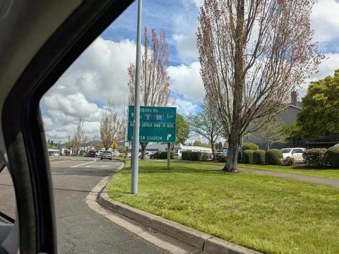 Roadside signage guides visitors toward the stadium and nearby streets Photos