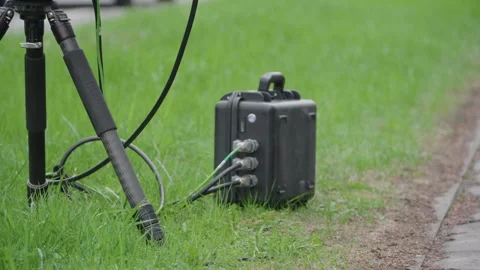 Roadside speed enforcement cameras on a tripod with cables and control box Stock Footage 336589023