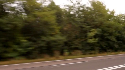 Roadside Vegetation and Fast Moving Cars Motion Blur Stock Footage 87840178