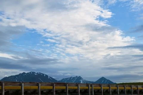 Roadside view of distant Alaskan mountains Stock Photos
