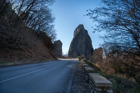 Roadside view of Meteora rock formations and barren trees in Greece 写真素材