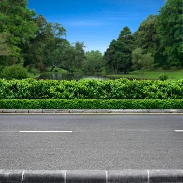 Roadside view of park Stock Photos