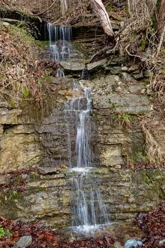 Roadside waterfall coming down the mountain Stock Photos