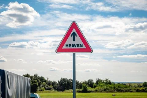 Roadsign with an arrow inside pointing to heaven Stock Photos