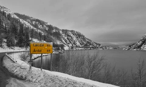 Roadsign by the lake BW Stock Photos
