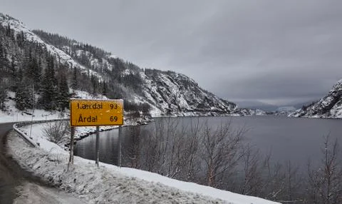 Roadsign by the lake Stock Photos