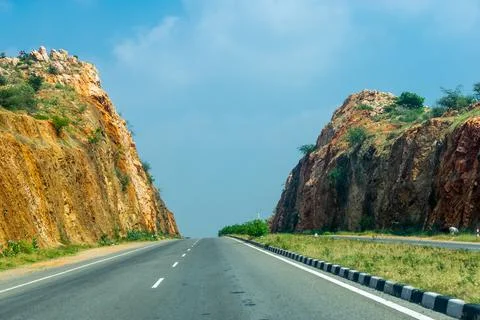 Roadway in between a Mountain Pass 写真素材