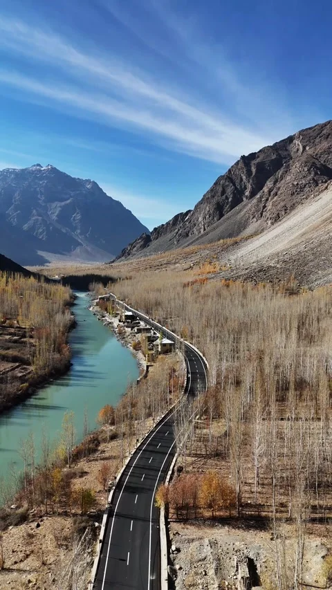 Roadway through Suru’s fall colors captured in a vertical drone flyover. Stock Footage 310662261