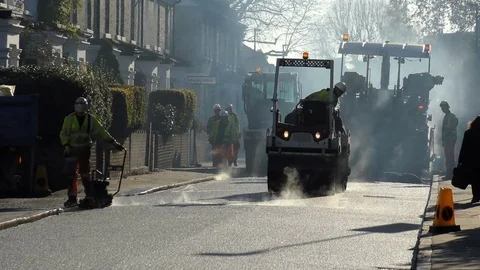 Roadwork Construction Man Working to Laying New Tarmac Paving Stock Footage 70212450