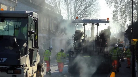 Roadwork Construction Man Working to Laying New Tarmac Paving Stock Footage 70237965