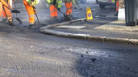Roadwork Construction Man Working to Laying New Tarmac Paving Stock Footage 70239494