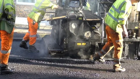 Roadwork Construction Man Working to Laying New Tarmac Paving Stock Footage 70308980