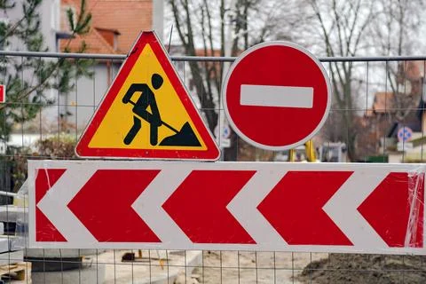 Roadwork Sign Displayed With Caution and Prohibition Indicators Near a Constr Stock Photos