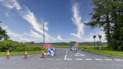 Roadwork signs mark a temporary lane closure Stock Photos
