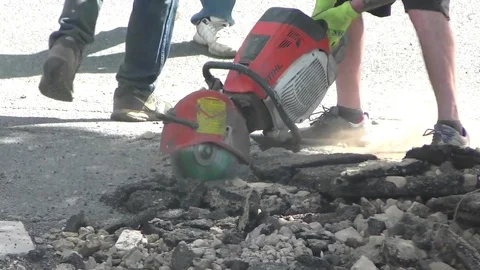 Roadworkers powerful blade saw cuts streets asphalt hot top, sound Stock-Footage 81527006