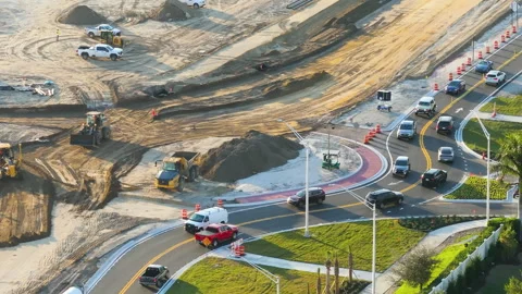 Roadworks construction site at roundabout intersection on American highway Stock Footage 283923171