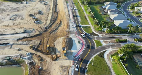 Roadworks construction site at roundabout intersection on American highway Stock Footage 309297039