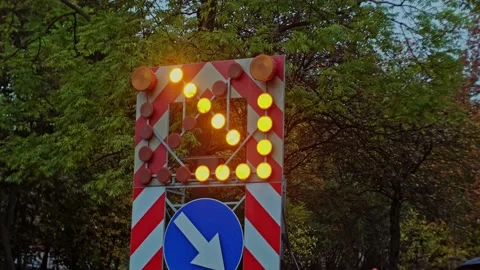 Roadworks Lane Arrow Caution Warning Sign with Orange Pulsing Lights Stock Footage 221094780