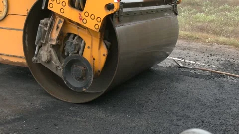 Roadworks, process of asphalting, blacktopping and paving new road layer Video stock 330350989