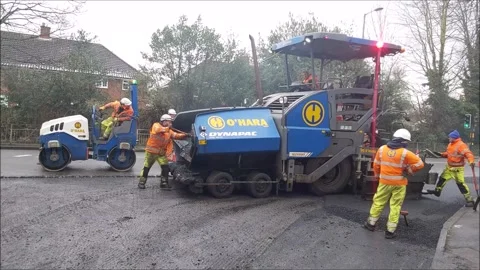 ROADWORKS, ROAD RESURFACING, TAR MACHINE, ROLLER MACHINE, ASPHALT, MEN WORKING Stock Footage 147287771