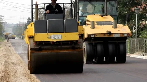 Roadworks. Steamrollers. Road rollers flattens asphalt. Paving. Asphalting. Stock Footage 41721374