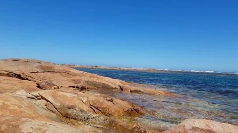 Roaming beach rock pool Stock Footage 101044510