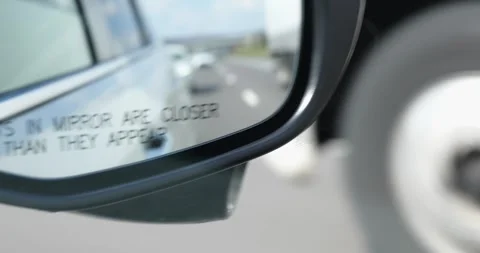 ROANE CO, TN - 13 MAR 2024: Rearview mirror of moving vehicle Stock Footage 280363113