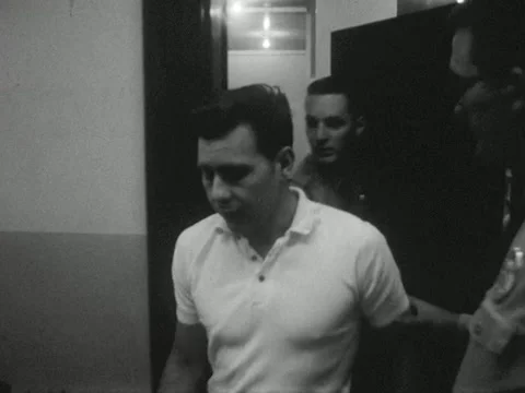 Roanoke, VA - 9/27/63: Man escorted from jail to courtroom Stock Footage 234237018
