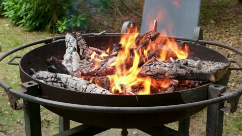 Roaring Backyard Campfire in Metal Fire Pit Stock Footage 337188657