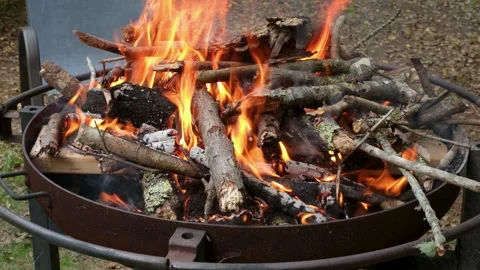Roaring Campfire Burning in Metal Fire Pit Stock Footage 337188527