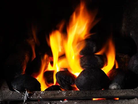 A roaring coal fire in close up Stock Photos