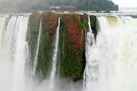 Roaring waterfall cascade on basaltic cliff with heavy mist in Iguazu, Argentina Stock Photos