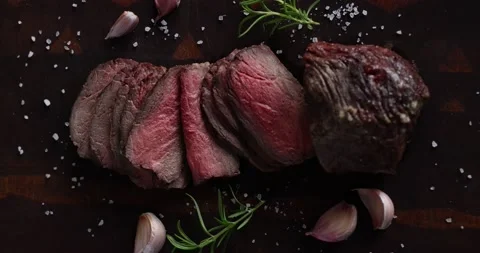 Roast beef on cutting board with salt and pepper. View from above. Stock Footage 237609147